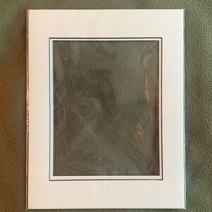 NIP Design A Mat. White and black. 11” x 14” for an.  8” x 10” picture.